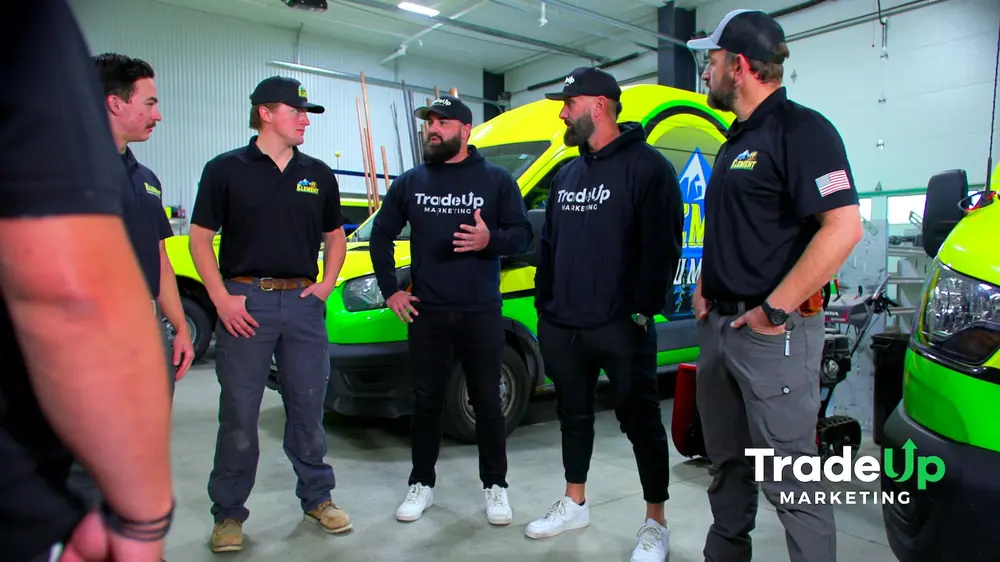 Jordan and Regan talking through the shoot with the Element Plumbing team in their garage