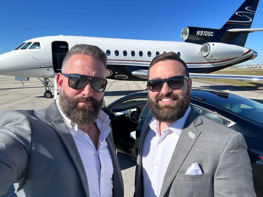 Jordan Lung and Regan Weiss beside a private jet